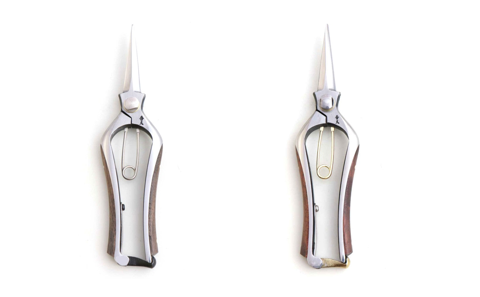 Two silver wine openers on a white background